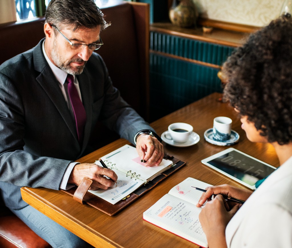 Capital Clarity accountant discussing business finances with a client