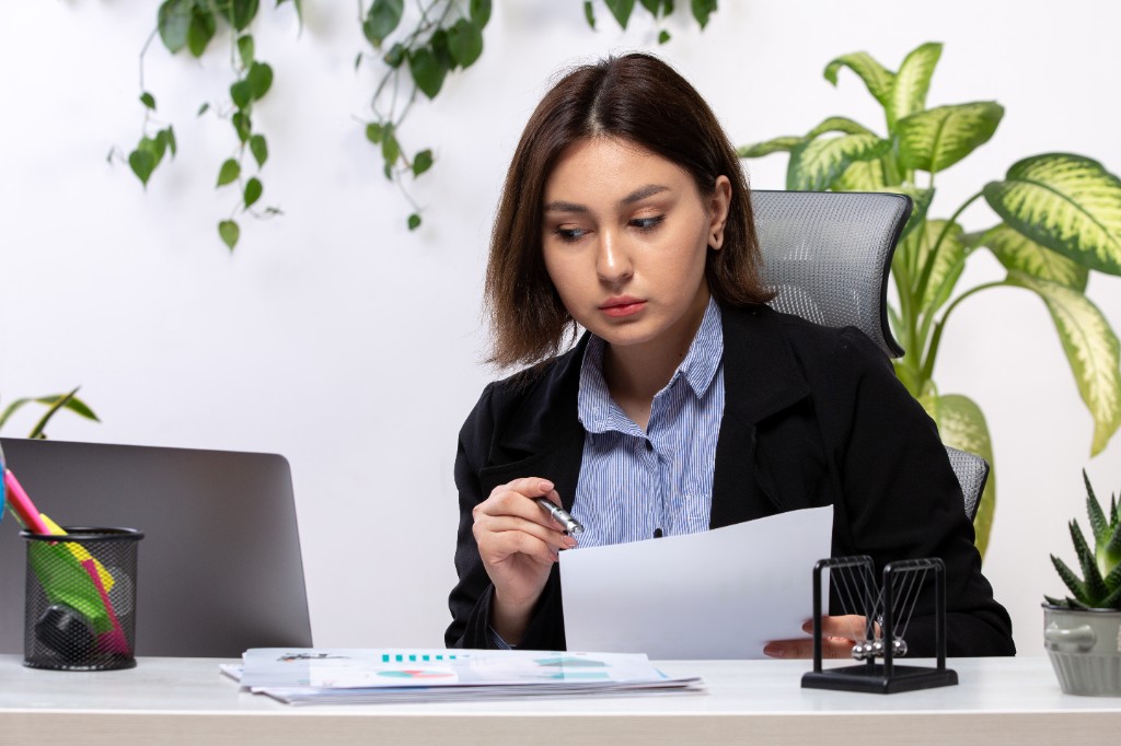 Accountants recording bookkeeping transactions